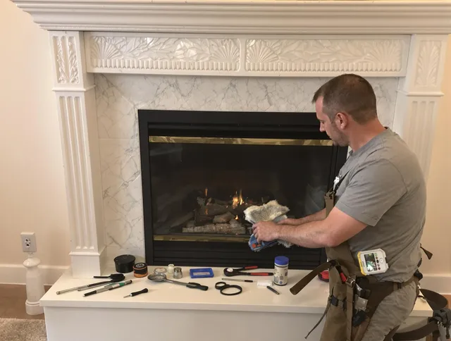 Norwell Chimney Sweep performing fireplace maintenance in Norwell, MA